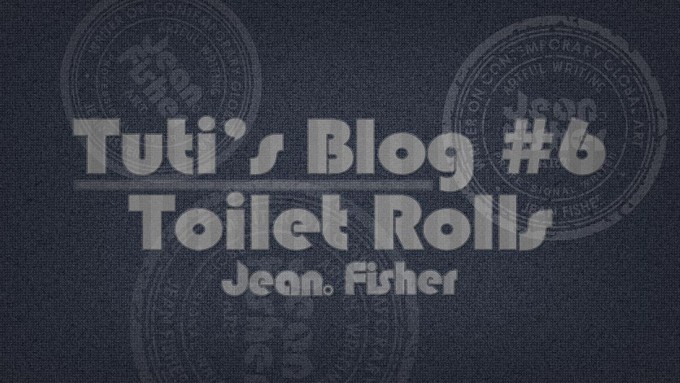 Toilet rolls text on a fabric background